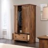 A Rustic Oak Drawer and Garment Rod Wardrobe Armoire